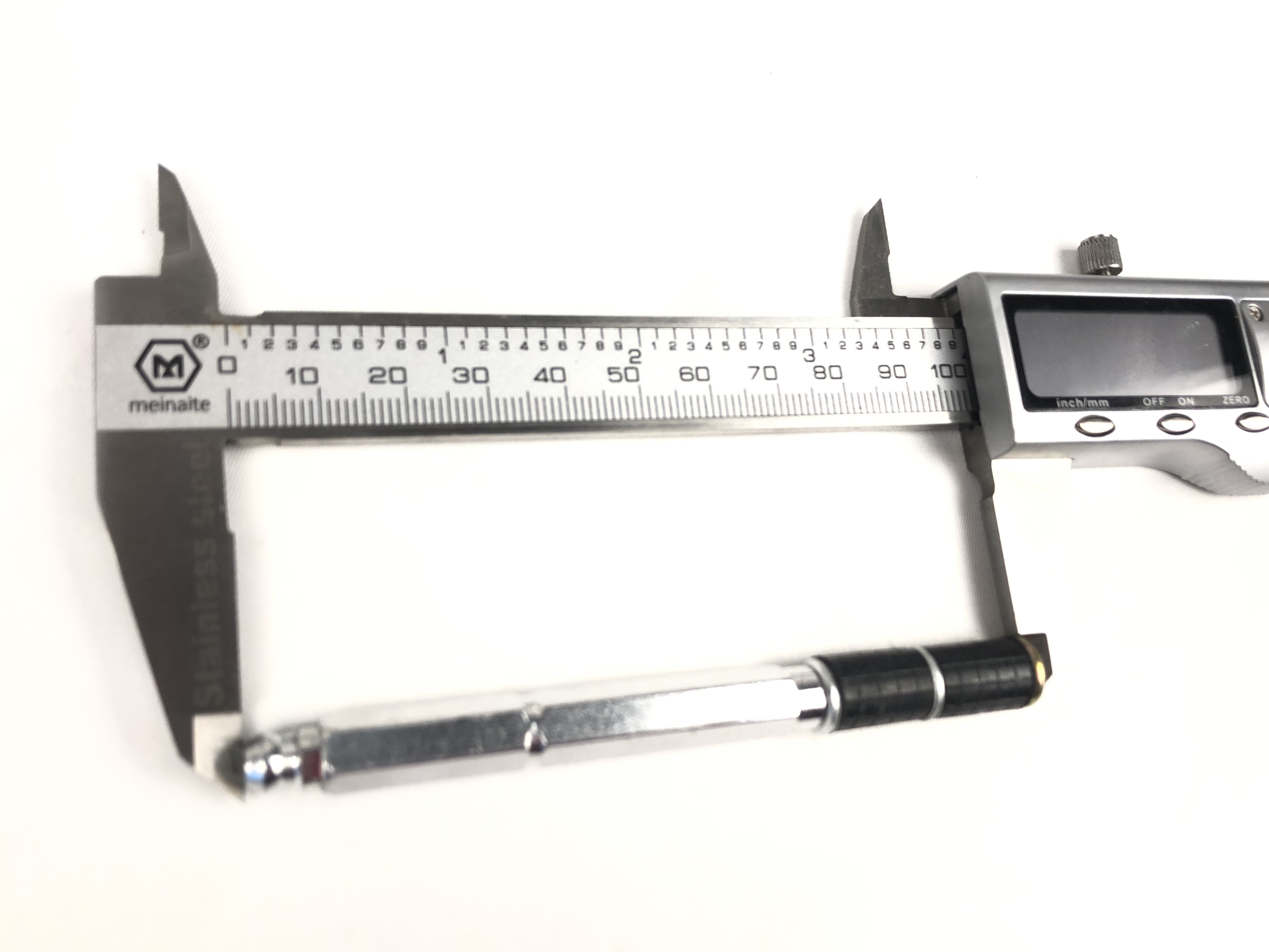 Close up of stainless steel injection packer with measurement scale