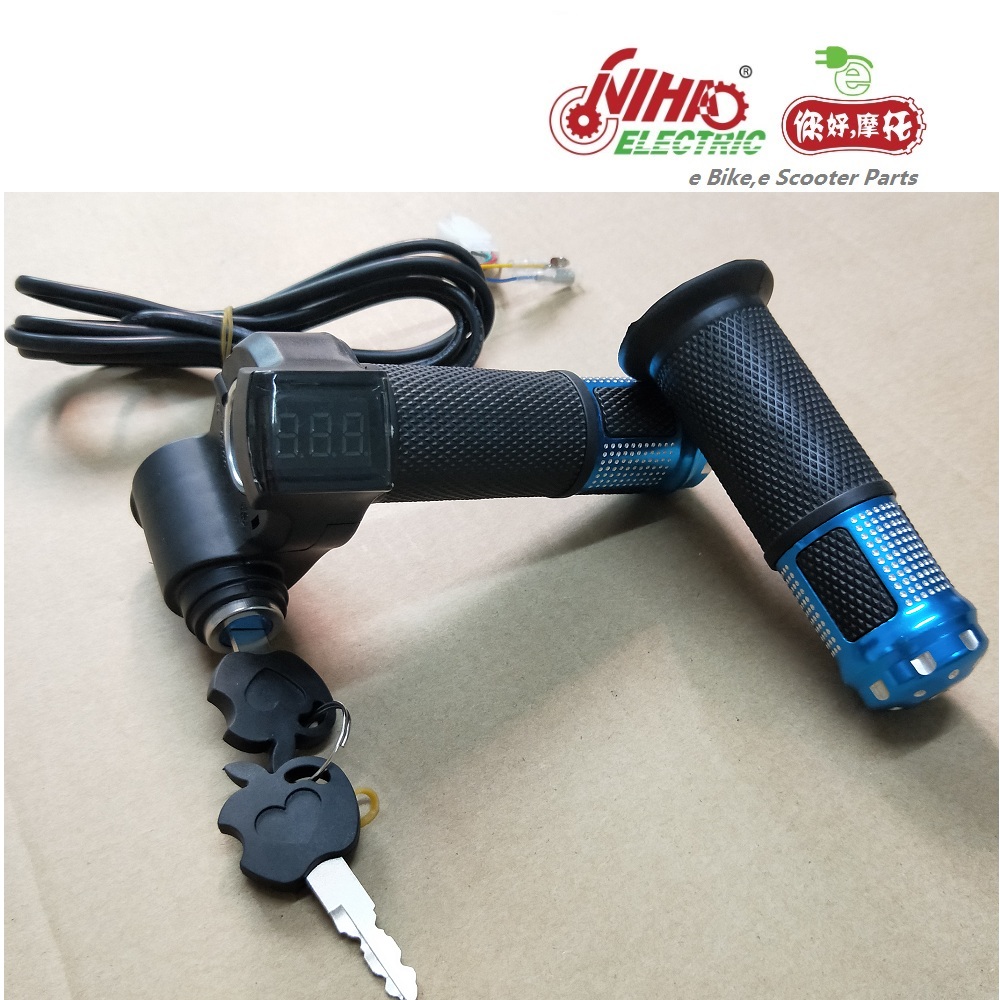 Close up of the textured twist grip throttle and ignition lock