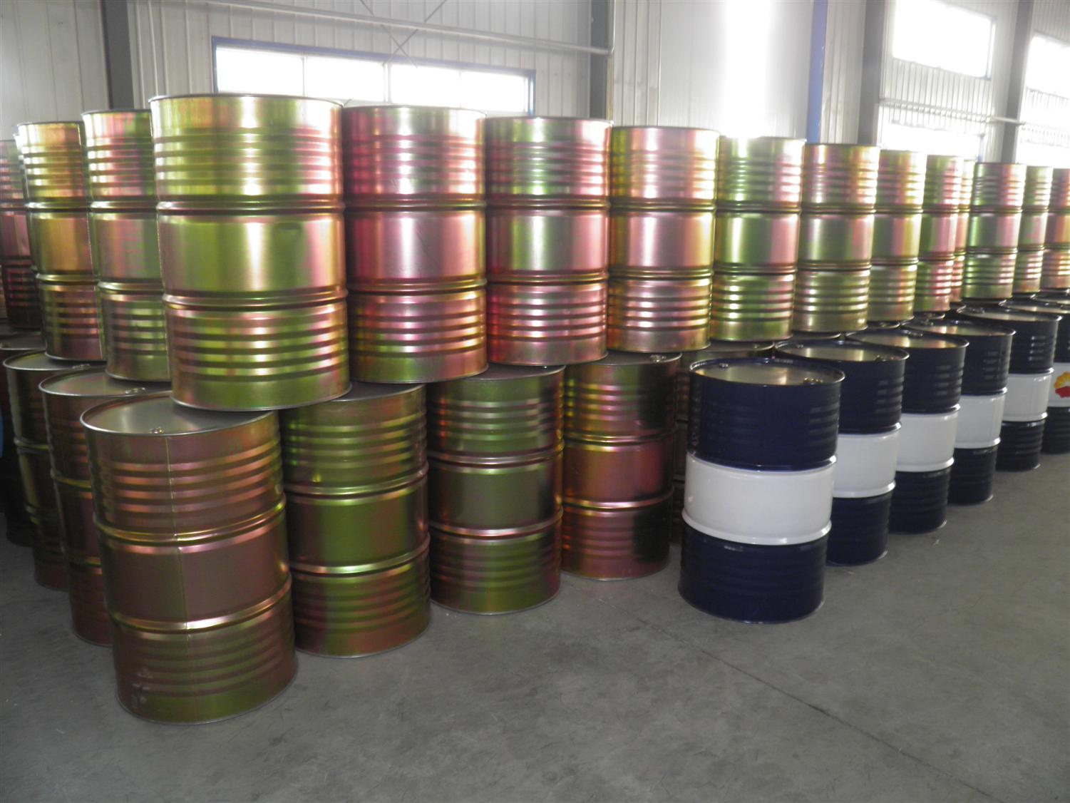 Stacked Steel Drums in Warehouse