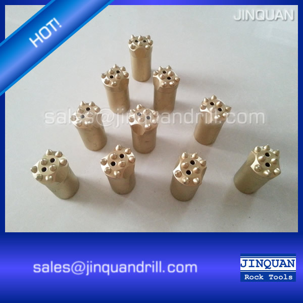 Close-up of 38mm and 40mm button bits