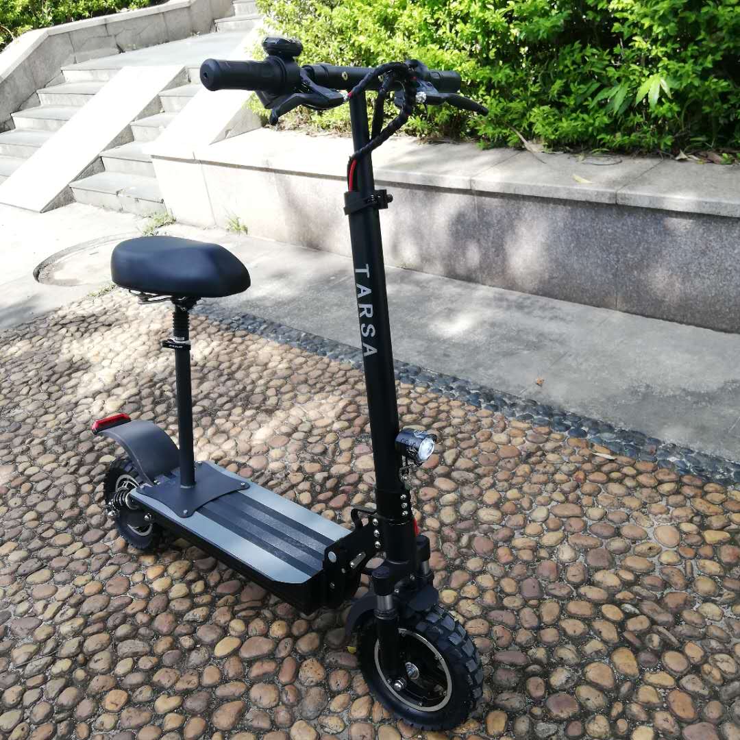Adult electric scooter with 500W motor, seat, and off-road tires