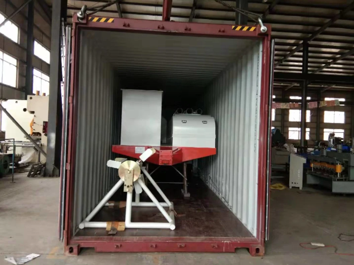 Hydraulic arch metal sheet roofing machine showing multiple forming rollers