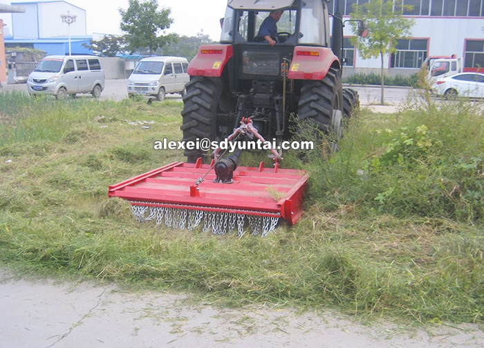 9G Mower attached to tractor via three-point hitch