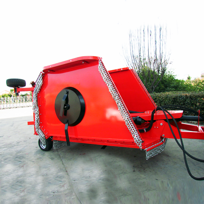 Top view of the red 9G mower showing adjustment levers and safety chains