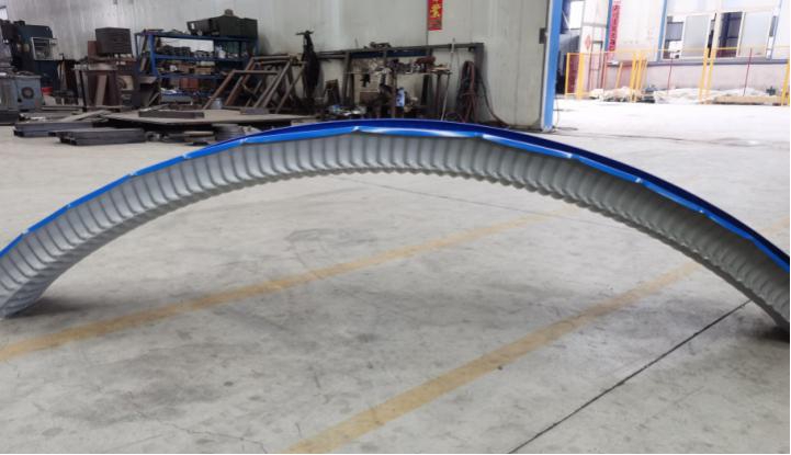 Formed arched metal roofing panels
