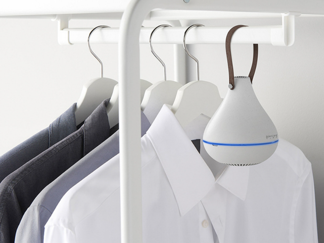 Portable aroma diffuser hanging in a closet