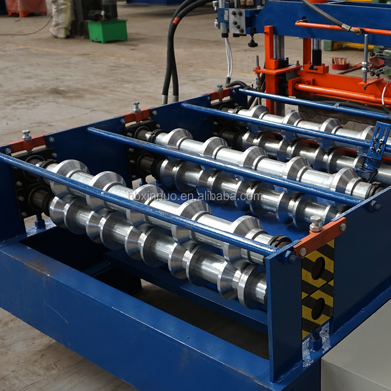 Close-up of the metal forming guides and rollers