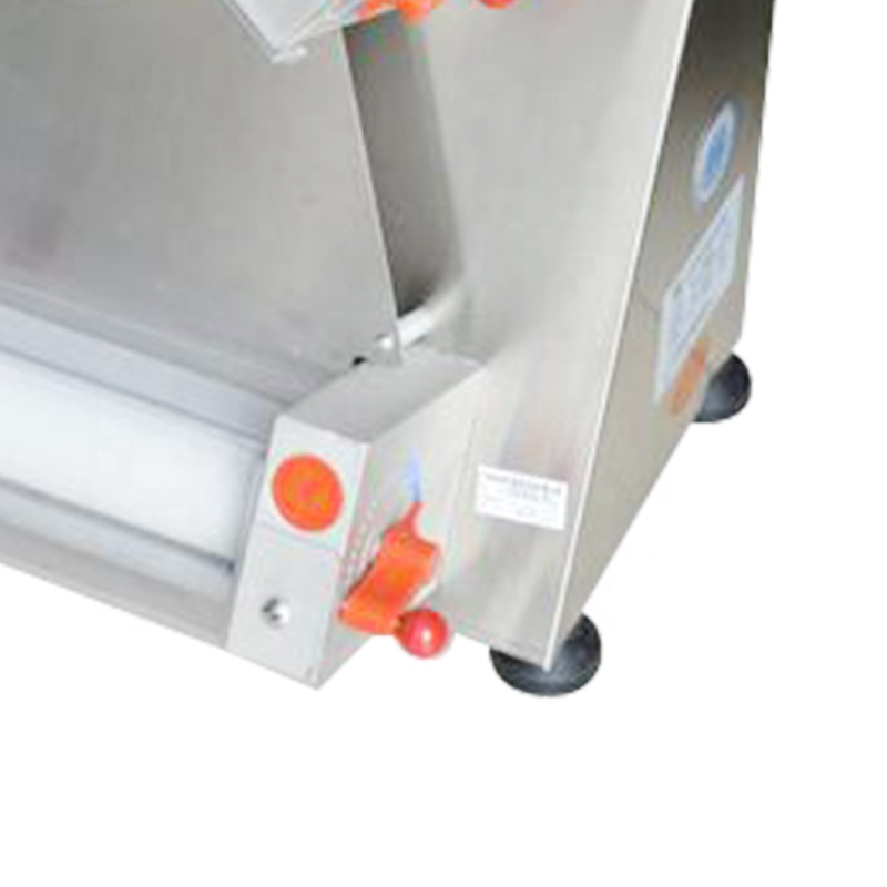 Close-up of the pizza dough cutting and pressing mechanism