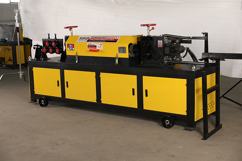 Rebar straightening machine highlighting the safety guards and emergency stop buttons.