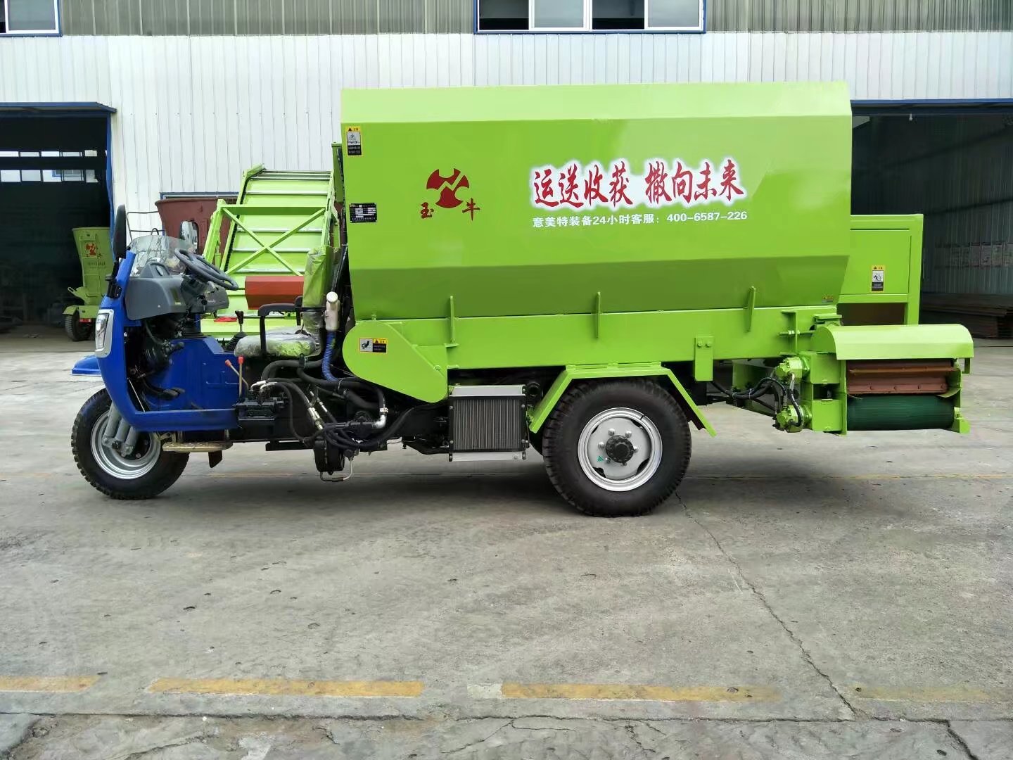 Three-wheeled bedding spreader in operation