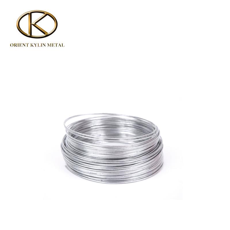 Coiled molybdenum spraying wire with alkaline wash surface