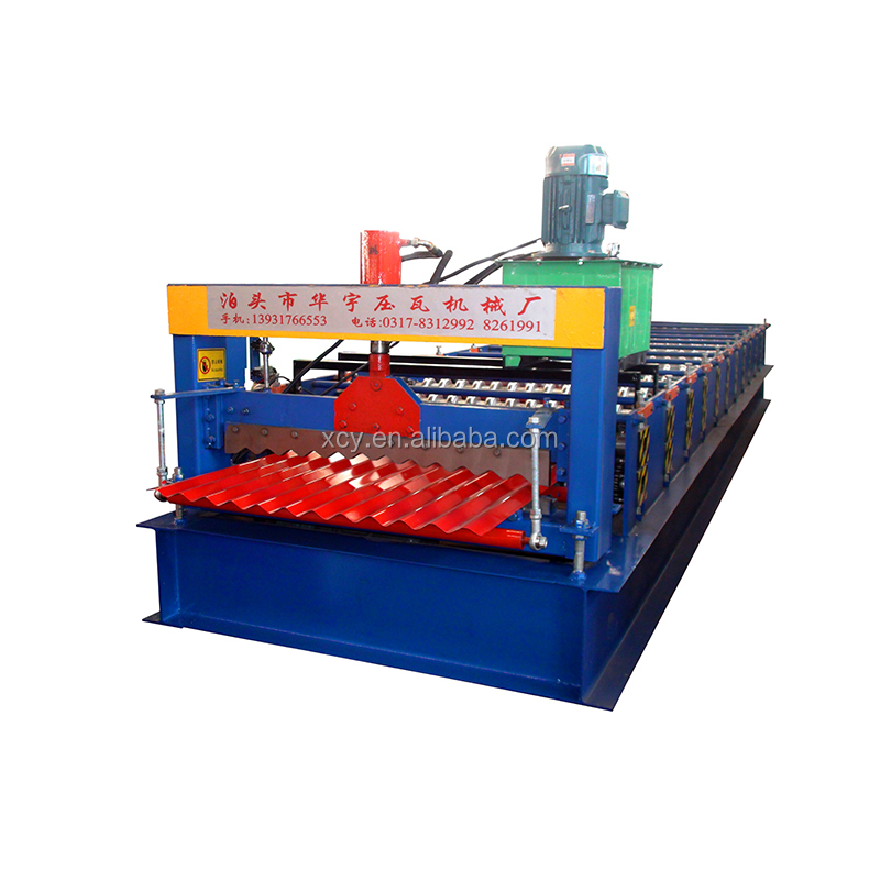 Close-up of the forming rollers and hydraulic cutting system