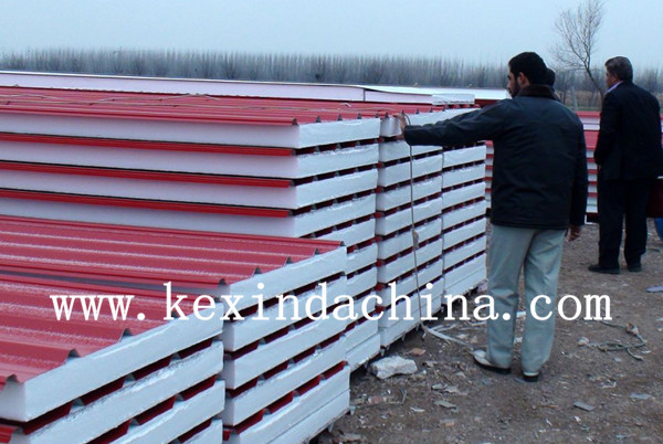 Red corrugated sandwich panels with white insulating core
