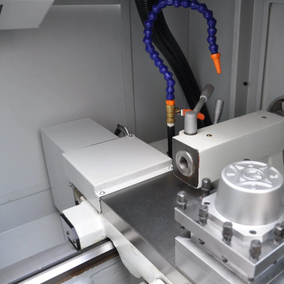 Interior view of the CNC lathe enclosure and worktable