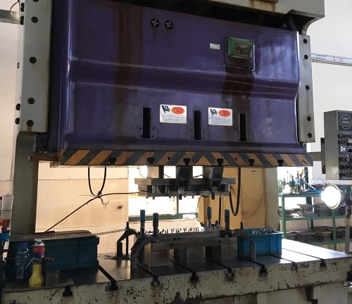 Industrial stamping press for metal part processing