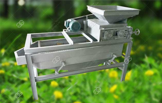 Commercial nut shelling machine side view showing motor and hopper