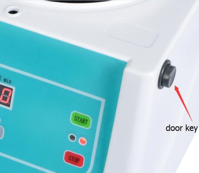 Front view of TG12MX Centrifuge showing digital control panel and safety door key