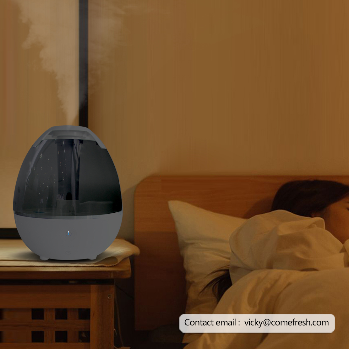 Humidifier with blue night light active in a dark room