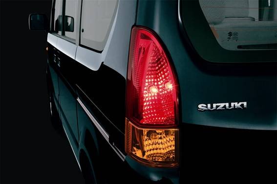 Rear light assembly showing multi-bulb design and integrated branding.