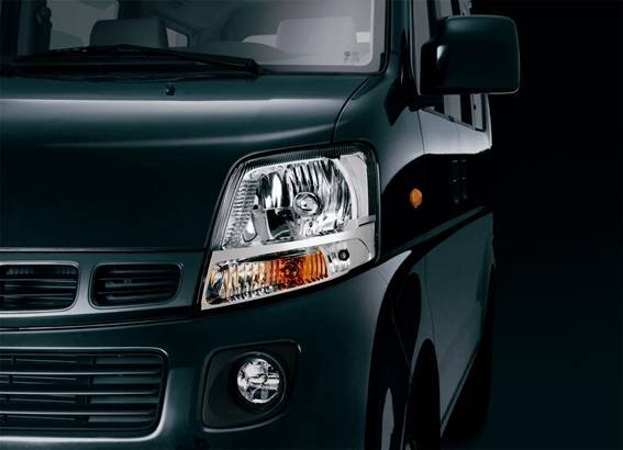 Front view detailing the headlight assembly, grille, and fog lights.