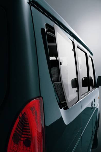 Side profile of the vehicle highlighting body panels and sliding windows.
