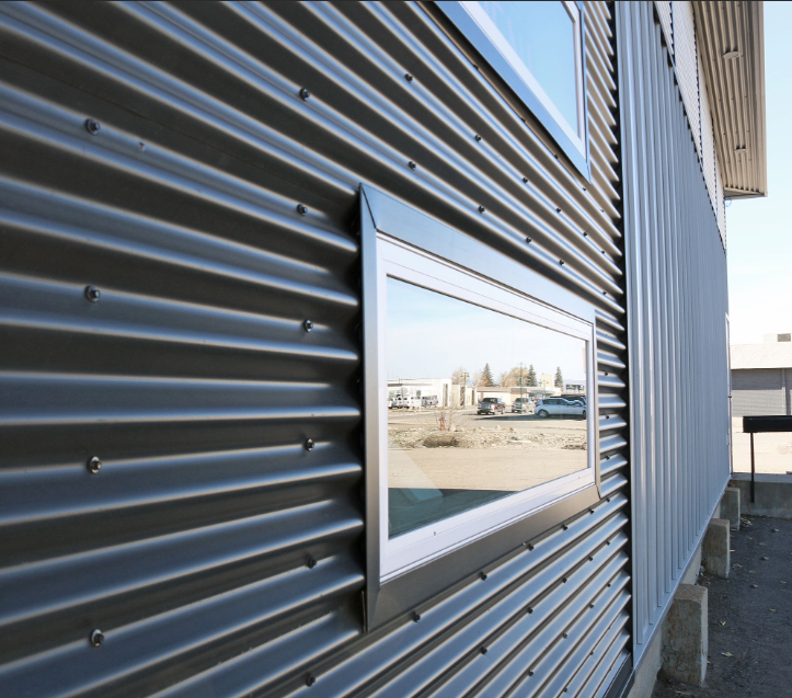 Finished corrugated metal wall cladding application
