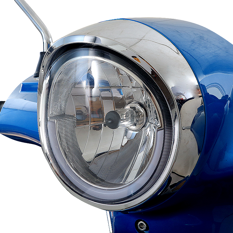 Close up of chrome headlight with LED daytime running light