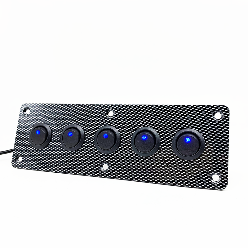 Close-up of blue LED rocker switches on aluminum panel