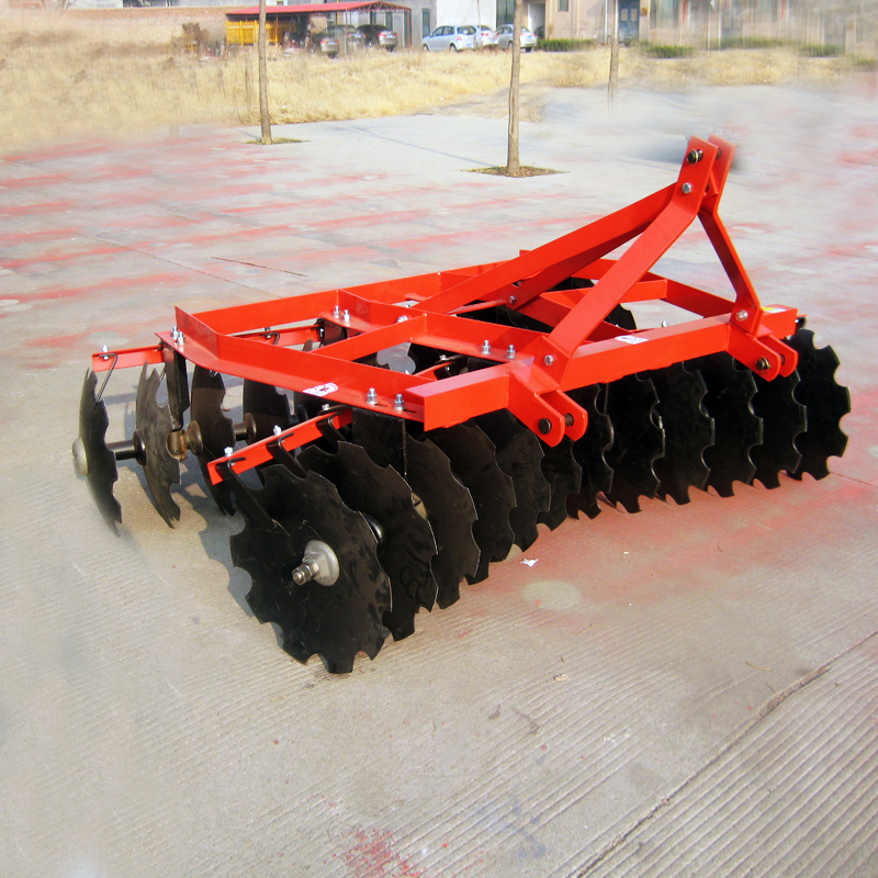 Close up of opposing disc gangs on a light duty harrow