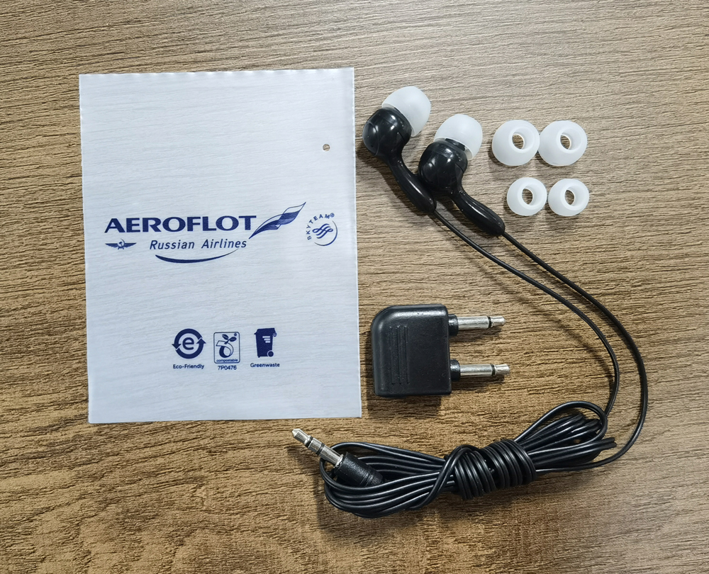 Disposable in-ear headphones with silicone tips and airline adapter