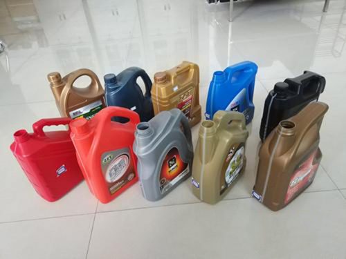 Assorted plastic automotive oil containers