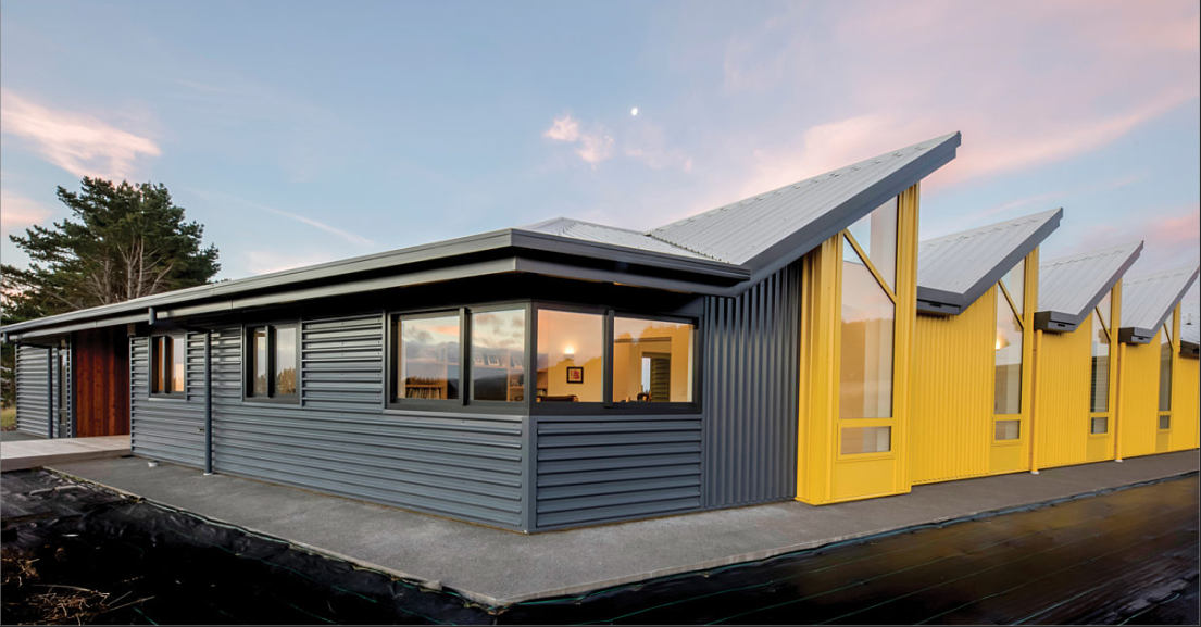 Modern building with gray and yellow metal sheeting