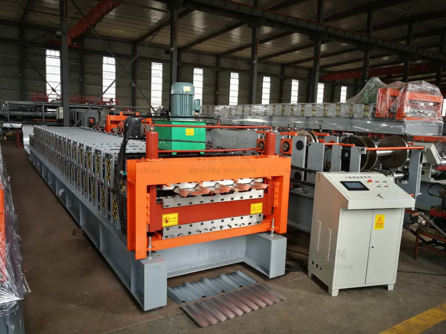 Double layer roll forming machine with orange frame and grey base