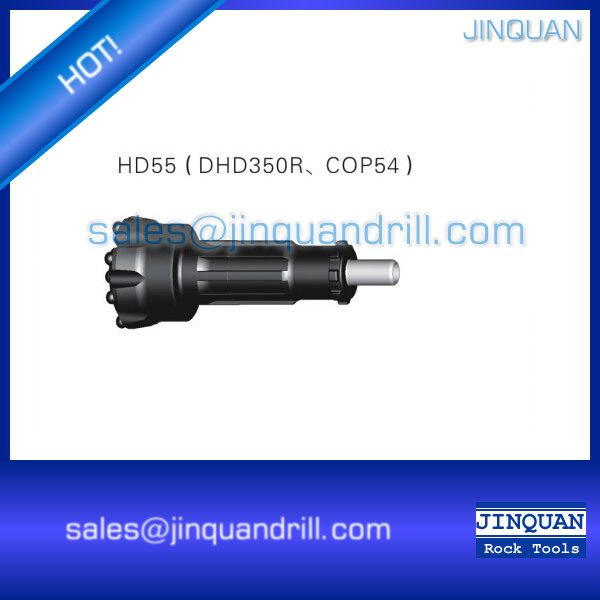 DTH drilling bit close-up showing gauge buttons and face design