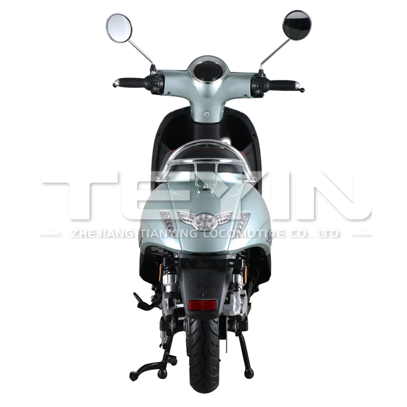 Close up of the scooter's front headlight and handlebar area
