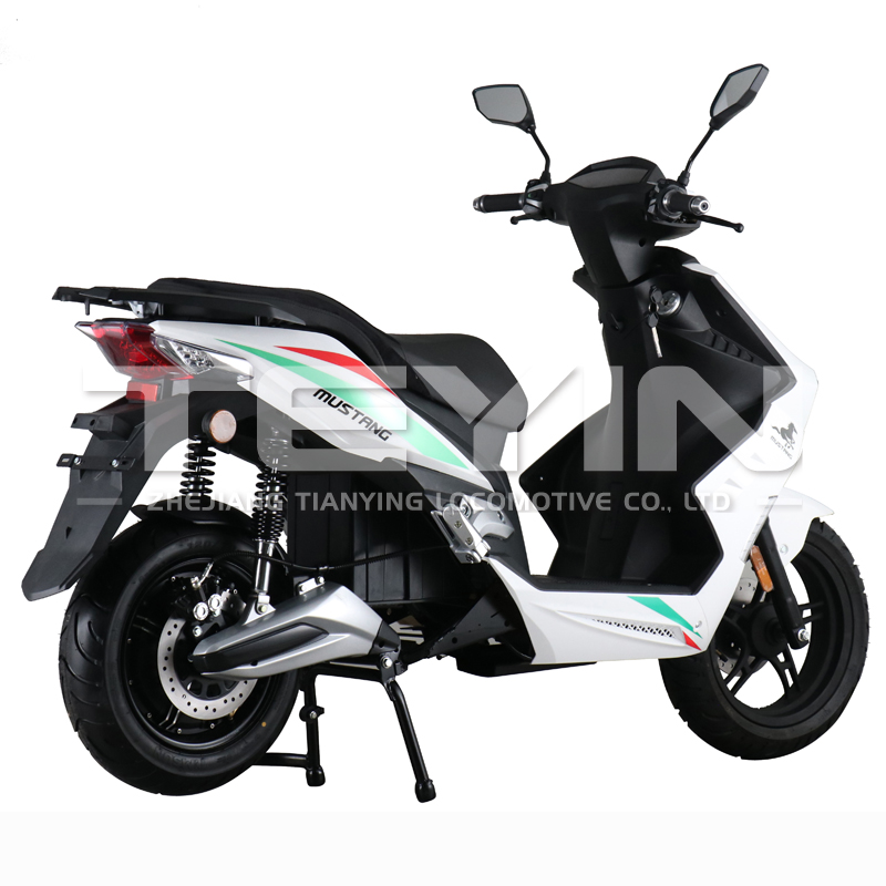 The electric motorcycle parked on a city street showing the aerodynamic fairings