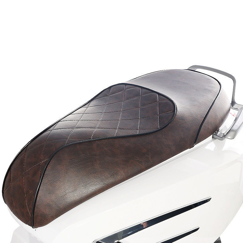 Close up of the brown leather seat with diamond stitching