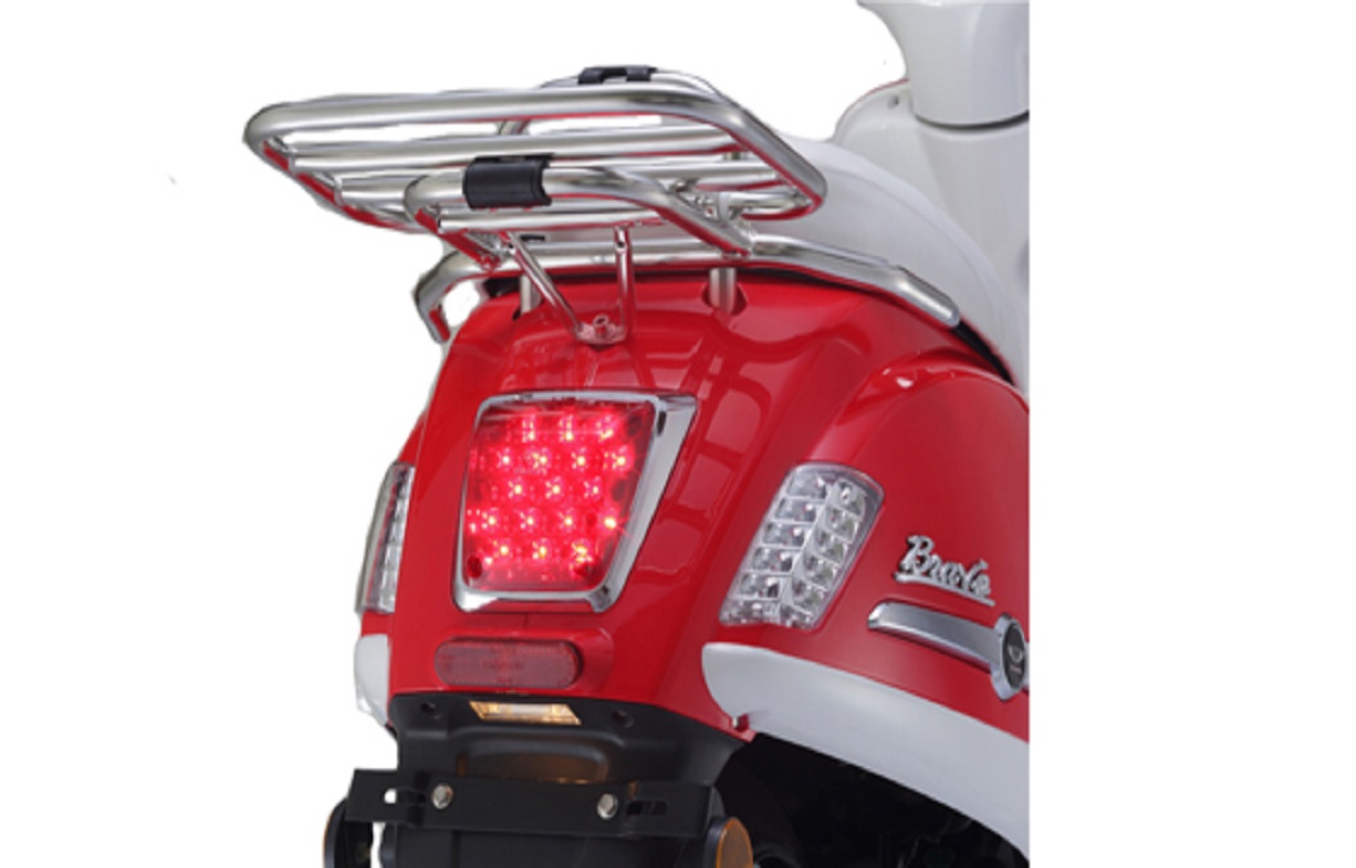 Rear view of the scooter showing luggage rack and chrome details