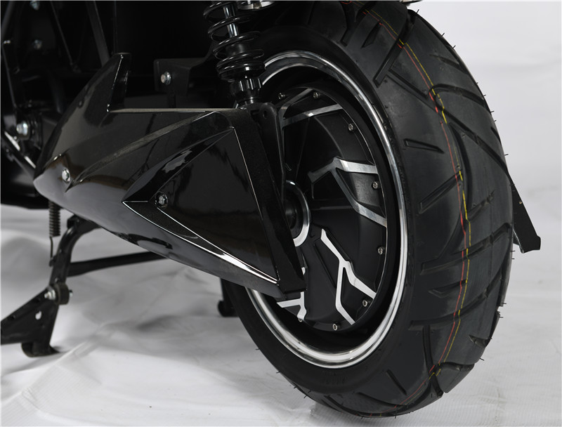 Side profile of the electric motorcycle showing the rear motor and suspension