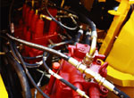 Excavator hydraulic valve block and hoses