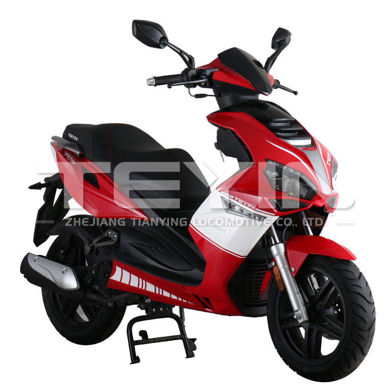 Side profile of the red and white scooter