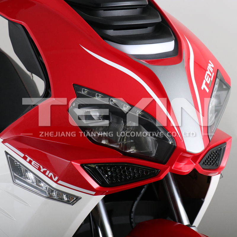 Close up of the scooter front suspension and wheel area