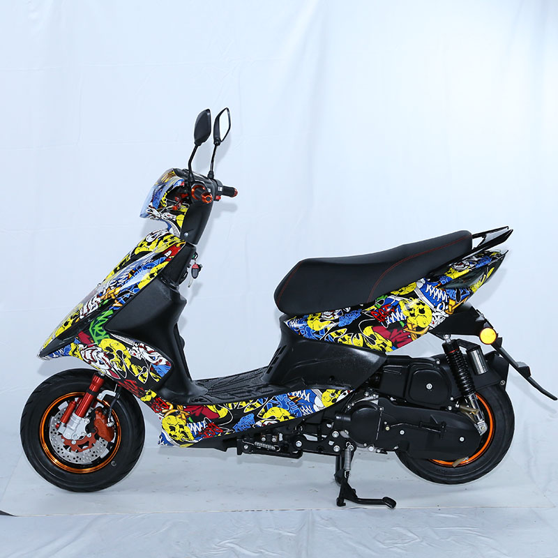 Side profile of the scooter showing graffiti decals