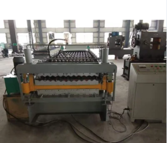 Side view of the roll forming machine showing the roller stations and steel frame.