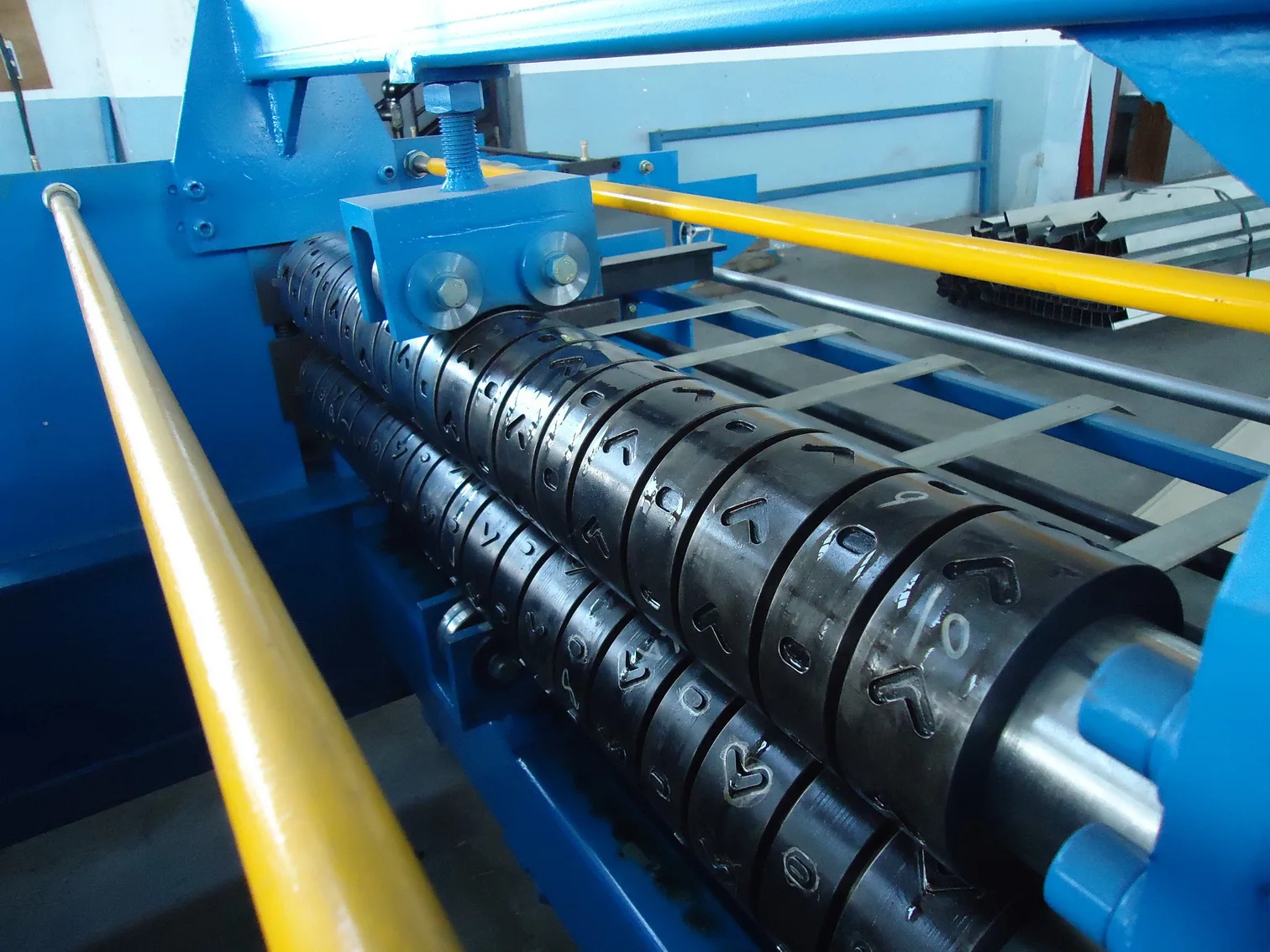 Close up of roll forming machine rollers