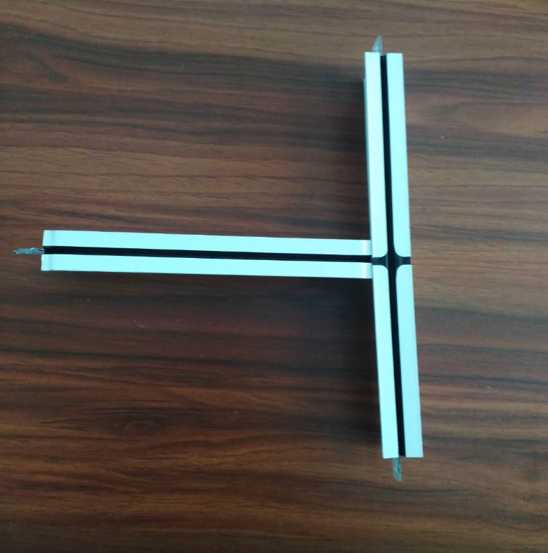 Aluminum T-grid profiles showing intersection and connection mechanism