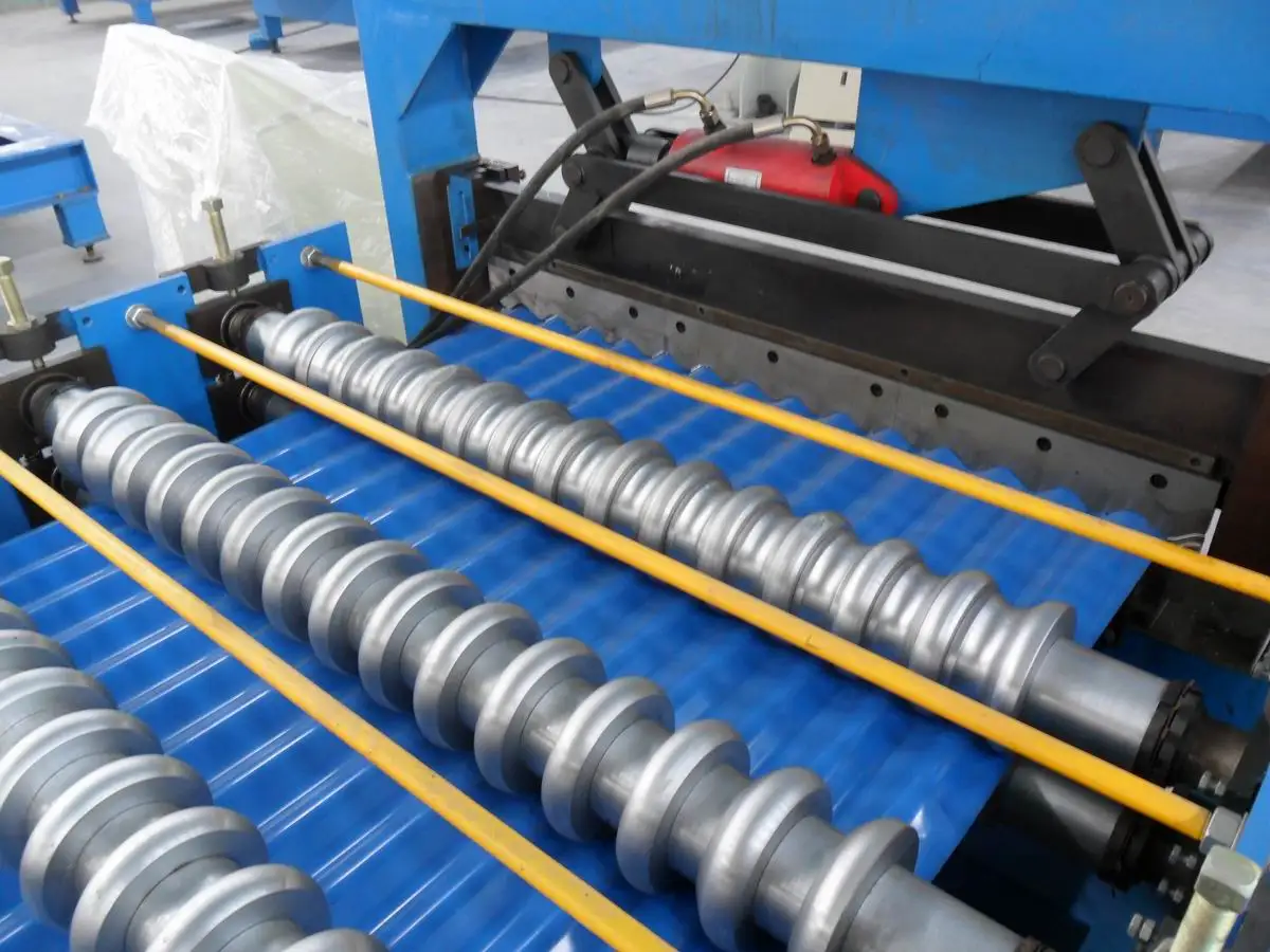 Wide shot of the corrugated roofing machine in an industrial setting