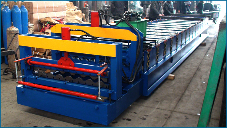 Side view of the blue and yellow glazed tile roll forming machine