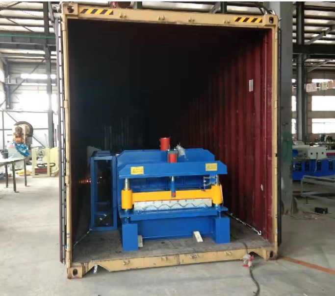 Side view of the blue and yellow roll forming machine
