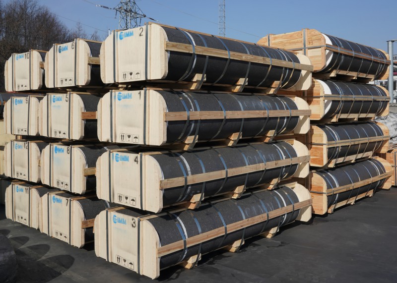 Graphite electrodes packaged in wooden crates with metal banding
